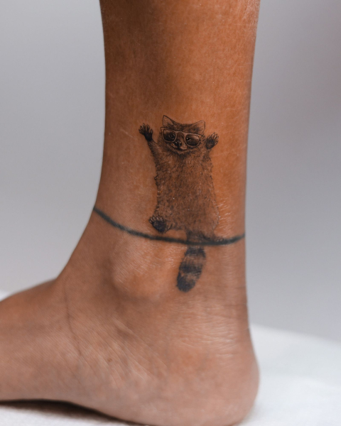 2026 tattoo trends microrealistic tattoos  raccoon on ankle